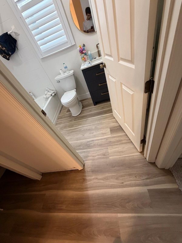Bathroom entry and hall with new LVP
