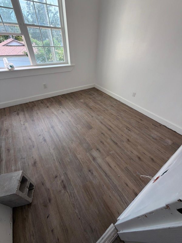 New construction corner bedroom with LVP and large window