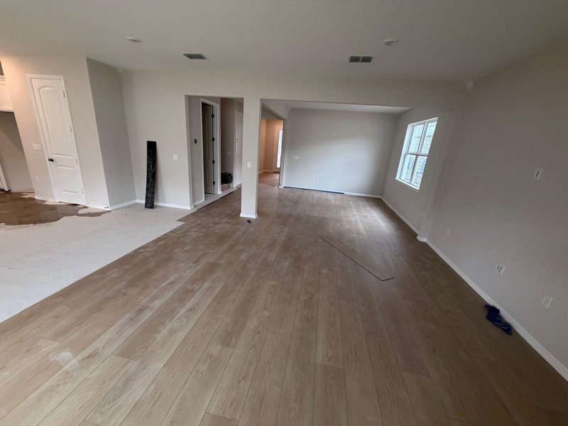 New construction open living area with LVP installed throughout